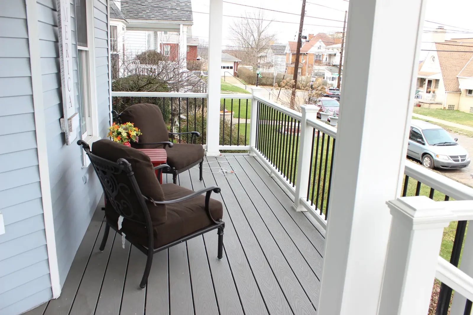 Wrap-around porch rebuild built by Oasis Custom Decks