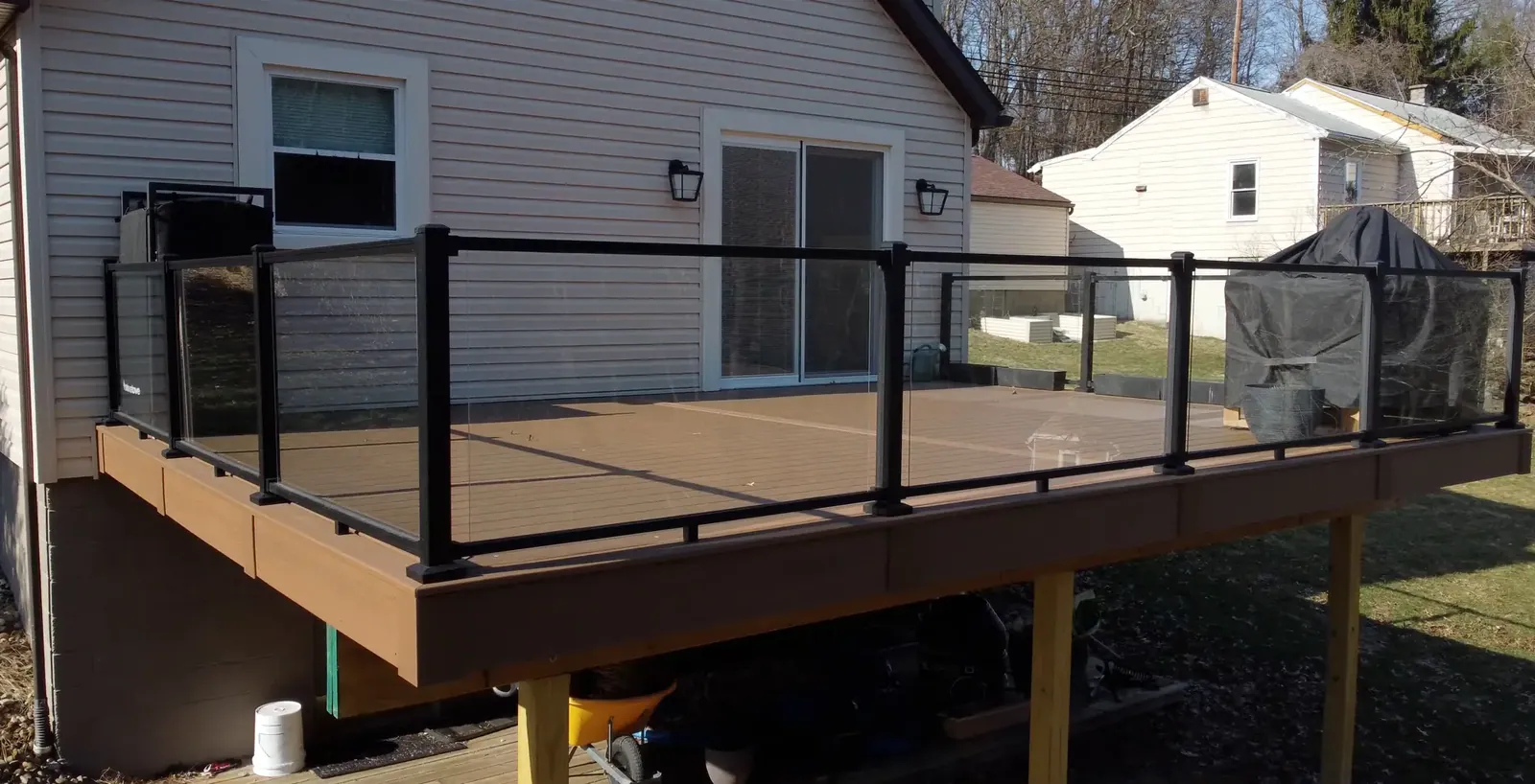 Glass railing deck built by Oasis Custom Decks